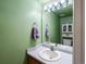 Bathroom featuring a vanity with a sink, a mirror, and a decorative cabinet at 12061 Ivy Way, Brighton, CO 80602