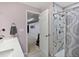 The bathroom features a stylish vanity and a step in shower with striking tile work at 12061 Ivy Way, Brighton, CO 80602