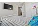This bedroom has a TV, closet, and an en-suite bathroom for added convenience at 12061 Ivy Way, Brighton, CO 80602