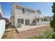 Exterior of home showcasing a spacious backyard with patio and second story balcony at 21642 E 55Th Ave, Denver, CO 80249