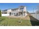 Spacious backyard with a concrete patio and a wooden storage shed at 21642 E 55Th Ave, Denver, CO 80249