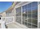 Second-story balcony with white railing, sliding glass door and view to adjacent houses at 21642 E 55Th Ave, Denver, CO 80249