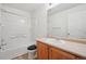 Bright bathroom with a shower and bathtub combination and a vanity with a light countertop at 21642 E 55Th Ave, Denver, CO 80249