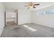 Bedroom with neutral carpet and a small window at 21642 E 55Th Ave, Denver, CO 80249