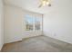 A large bedroom bathed in natural light from two windows, complemented by a ceiling fan with light at 21642 E 55Th Ave, Denver, CO 80249