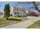 Charming two-story home featuring a manicured lawn and attached two car garage at 21642 E 55Th Ave, Denver, CO 80249