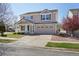 Well maintained two-story home with landscaped front yard and attached garage at 21642 E 55Th Ave, Denver, CO 80249
