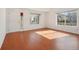Well lit living room showcasing wood floors and entrance door at 21642 E 55Th Ave, Denver, CO 80249