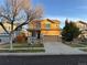 Two-story house with attached garage and front porch at 14389 E 101St Pl, Commerce City, CO 80022