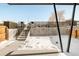 Small backyard with concrete patio and snowy ground at 3433 Lawrence St # 1, Denver, CO 80205