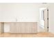 Basement wet bar with light wood cabinets and countertop at 3433 Lawrence St # 1, Denver, CO 80205