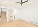 Spacious basement with light wood flooring and ceiling fan at 3433 Lawrence St # 1, Denver, CO 80205
