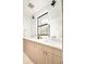 Modern bathroom with double vanity and light wood cabinets at 3433 Lawrence St # 1, Denver, CO 80205