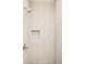 Shower stall with light beige textured wall tiles at 3433 Lawrence St # 1, Denver, CO 80205