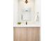 Modern powder room with white vanity and geometric tile at 3433 Lawrence St # 1, Denver, CO 80205