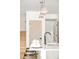 Stylish kitchen island with pendant lighting and seating for four at 3433 Lawrence St # 1, Denver, CO 80205