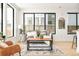 Spacious living room with large windows and gray sofa at 3433 Lawrence St # 1, Denver, CO 80205