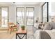 Bright living room features a comfy sofa, large windows, and stylish coffee table at 3433 Lawrence St # 1, Denver, CO 80205