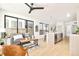 Open concept living and kitchen area with light wood floors and modern design at 3433 Lawrence St # 1, Denver, CO 80205