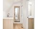 Modern wet bar with a sink and access to a deck at 3433 Lawrence St # 1, Denver, CO 80205