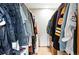 Walk in closet with custom storage solutions and plenty of space at 7221 S Brook Forest Rd, Evergreen, CO 80439