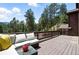 Spacious deck with comfortable seating, ideal for outdoor relaxation and enjoying the natural surroundings at 7221 S Brook Forest Rd, Evergreen, CO 80439