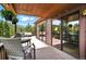 Inviting outdoor deck with comfortable seating, perfect for enjoying the surrounding mountain views at 7221 S Brook Forest Rd, Evergreen, CO 80439