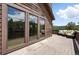 Exterior view of a home with sliding glass doors out to the deck at 7221 S Brook Forest Rd, Evergreen, CO 80439