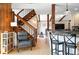 Bright open living space with wood finishes and comfortable seating at 7221 S Brook Forest Rd, Evergreen, CO 80439