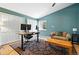 Spacious office with desk, chair, and comfortable seating area at 7221 S Brook Forest Rd, Evergreen, CO 80439