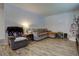 Cozy living room featuring hardwood floors and ample seating at 6651 Albion St, Commerce City, CO 80022