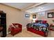 Basement bedroom with a queen-size bed and sitting area at 10399 Zenobia Ct, Westminster, CO 80031