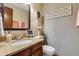 Small bathroom with granite vanity and decorative mirror at 10399 Zenobia Ct, Westminster, CO 80031