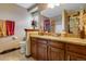 Well-appointed bathroom with granite vanity and toilet at 10399 Zenobia Ct, Westminster, CO 80031