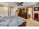 Main bedroom with ensuite bathroom and TV at 10399 Zenobia Ct, Westminster, CO 80031