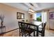 Dining room with dark wood table, six chairs, and backyard access at 10399 Zenobia Ct, Westminster, CO 80031