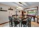 Bright dining room with a dark wood table and six chairs at 10399 Zenobia Ct, Westminster, CO 80031