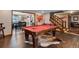 Game room with a pool table and hardwood floors at 10399 Zenobia Ct, Westminster, CO 80031