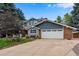 Two-story home with attached garage and landscaping at 10399 Zenobia Ct, Westminster, CO 80031