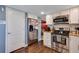 Kitchen with stainless steel appliances and white cabinets at 10399 Zenobia Ct, Westminster, CO 80031