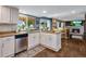 Bright kitchen with island, stainless steel appliances, and hardwood floors at 10399 Zenobia Ct, Westminster, CO 80031