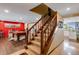 Elegant wooden staircase with carpeted steps at 10399 Zenobia Ct, Westminster, CO 80031