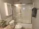 Bathroom featuring a vanity and enclosed shower-tub combination with neutral finishes at 710 S Clinton St # 3A, Denver, CO 80247