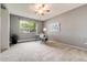 Bedroom featuring neutral carpet and a work space by the window with natural light at 710 S Clinton St # 3A, Denver, CO 80247