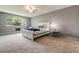 Bedroom featuring neutral carpet and a window view of the outside neighborhood at 710 S Clinton St # 3A, Denver, CO 80247
