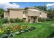 Charming condo building with colorful flower garden and green lawn at 710 S Clinton St # 3A, Denver, CO 80247