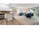 Bright living space with open layout, leading from modern kitchen to a comfortable seating area at 710 S Clinton St # 3A, Denver, CO 80247