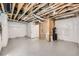 Unfinished basement with insulated walls and concrete floor ready for customization at 8822 Fraser River Loop, Littleton, CO 80125