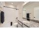 Modern bathroom with sleek vanity, granite counters, and black fixtures at 8822 Fraser River Loop, Littleton, CO 80125
