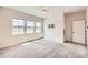 Airy bedroom with large windows, neutral carpet and ceiling fan. Great natural light at 8822 Fraser River Loop, Littleton, CO 80125